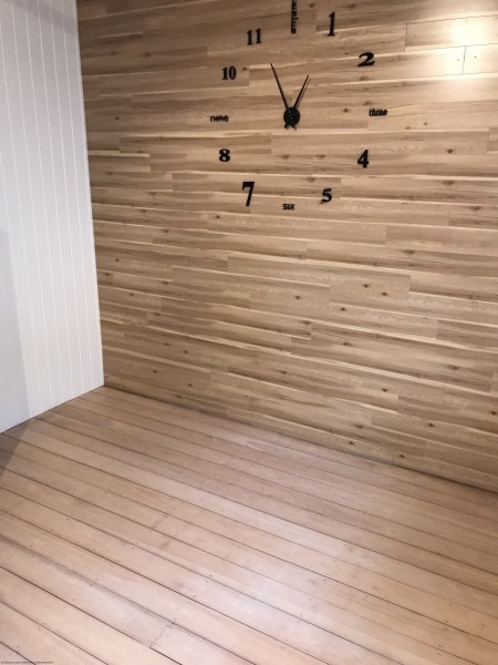 Timber wall and floor with clock